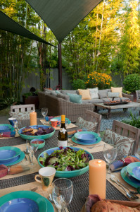 A double layer of pale green sails provides cool shade to a new dining and lounging area.